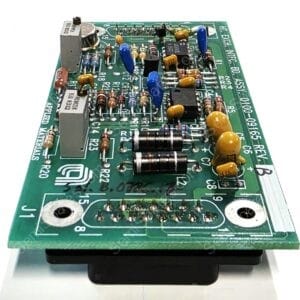 Green circuit board populated with resistors, capacitors, and ICs, photographed at an oblique angle.