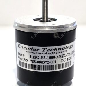 Close-up of a black encoder housing with a vertical metal shaft and a barcode-label wrap. It appears to be a position-sensing device used in machinery.