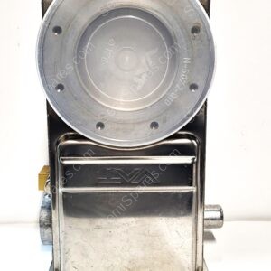 Front view of a vintage metal espresso machine with a large round dial-like lid on top and a sturdy base.