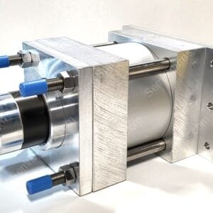 Metal precision vise with blue-handled adjustment screws clamping a cylindrical part.