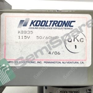 Close-up of a Kooltron ic cooling unit label with slogan 'Cooling Excellence for Electronics' and power info (115V).