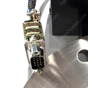 Close-up of a braided electrical cable connected to a metal multi-pin connector with gold pins.