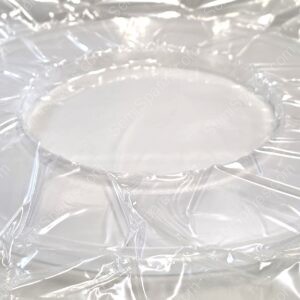 Close-up of crumpled, shiny aluminum foil with numerous folds and reflections.