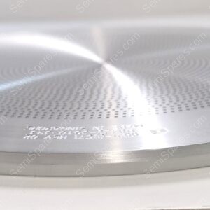 Close-up of a circular brushed metal speaker with a perforated center grill on a white surface.