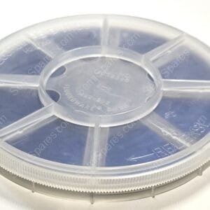 Close-up of a translucent plastic reel with four spokes and a ridged outer edge, viewed from above