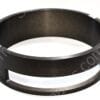 Close-up of a black metal circular ring with silver mounting tabs and small screws along the rim.