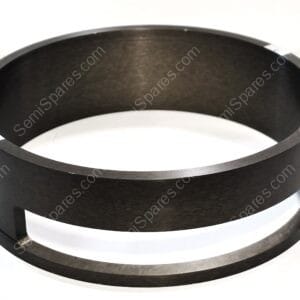 Close-up of a black metal circular ring with silver mounting tabs and small screws along the rim.