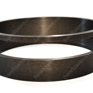 Close-up of a dark wood circular band with a metal rim and small screws, forming a hollow cylinder edge view.