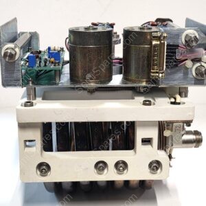 Rear view of a vintage electrical rack with two large cylindrical capacitors, circuit board, and wiring