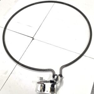 Large circular rubber or metal ring on a white surface with industrial wiring and a small electrical control box at the bottom.