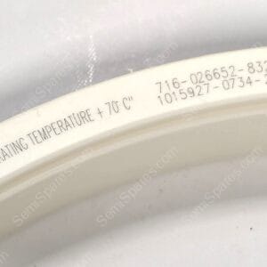 Close-up of a white curved surface with printed text reading 