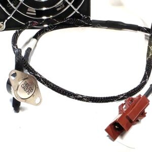 Close-up of an electrical wiring harness featuring braided black cables, a round metal terminal, and a red connector on a white background.