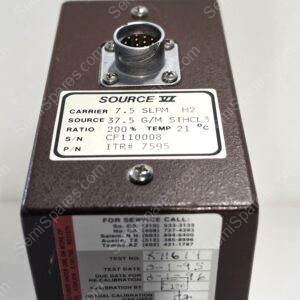 Close-up of a multi-pin circular connector mounted on a brown metal panel with four screws showing gold pins inside the receptacle.