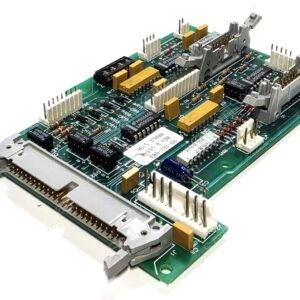 Angled view of a green printed circuit board with multiple edge connectors, white pin headers, yellow capacitors, and black integrated circuits.