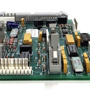 Printed circuit board with connectors, capacitors, and ICs seen from edge, showing labels and mounting hardware on green PCB