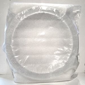 A silver-gray foam block wrapped in clear plastic, resting on a white surface.