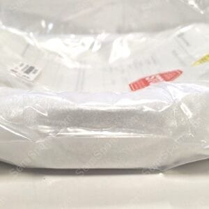 White plastic shipping bag on a white surface with a barcode label and red warning sticker visible at the center-right.