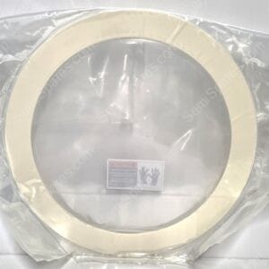 New white toilet seat sealed in clear plastic packaging with a safety label visible on the lid area