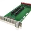Green circuit board with edge connectors and red terminal strip mounted on metal frame, viewed from angled side.