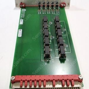 Green PCB with two vertical rows of black integrated circuits and a large red terminal block along the bottom edge, plus small resistors and connectors nearby.