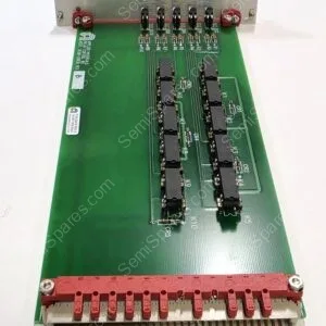 Green PCB with two vertical rows of black integrated circuits and a large red terminal block along the bottom edge, plus small resistors and connectors nearby.