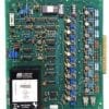 Green circuit board densely populated with resistors, capacitors, ICs, and a black PM593 power module; edge connector on the right.