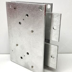 Close-up of a silver galvanized hinge block with multiple drilled holes and a connected bracket extending to the right.