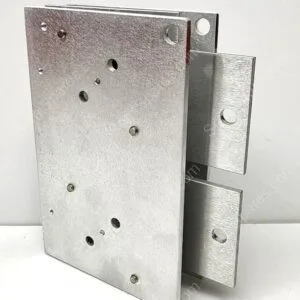 Close-up of a silver galvanized hinge block with multiple drilled holes and a connected bracket extending to the right.
