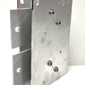 Close-up of a heavy, machined metal hinge or mounting plate with multiple screws and rounded bolts.