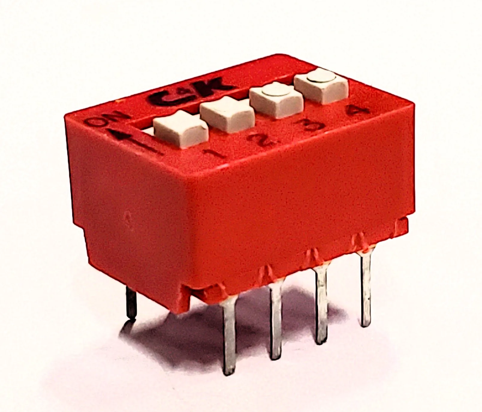 BD04 | DIP SWITCH SPST 4 POSITION THROUGH HOLE SLIDE ACTUATOR 100MA 5VDC RAISED PC PIN - Image 2