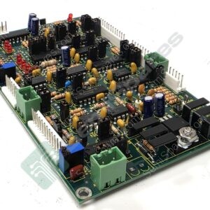 Circuit board densely populated with resistors, capacitors, connectors, and DIP ICs seen from a tilted angle.