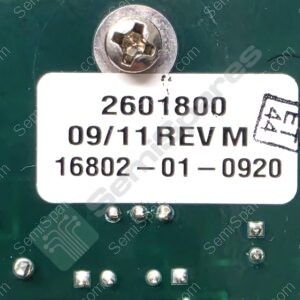 Close-up of a metal screw securing a circuit board with a white label showing numbers 2601800 and date 09/11 REV M on green PCB.