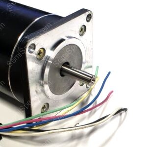 Close-up of a metal motor housing with a protruding shaft and screw holes, plus multicolored wires nearby