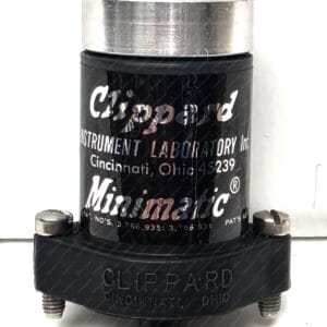 Close-up of a black laboratory device with a silver top and white text mentioning Cincinnati, Ohio; part of a lab instrument.