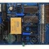 Blue vintage computer motherboard with multiple integrated circuits, resistors, and edge connectors, viewed from above.