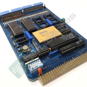 Blue computer motherboard with edge connector and multiple DIP ICs, RAM sockets, and a yellow module labeled ADC, seen at an angle on a white surface.