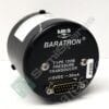 Close-up of a black circular MKS Baratron pressure transducer with a multi-pin connector and screws visible at the bottom edges, showing model details and label text.