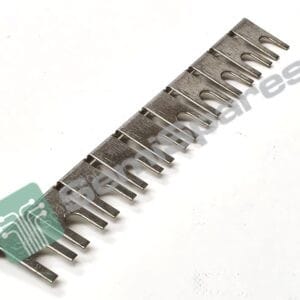 Close-up of a spiral-bound notebook spine with metal rings seen diagonally, green tag overlapping the edge.
