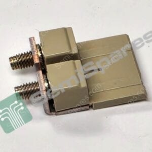 Close-up of a metal threaded stud attached to a beige plastic connector housing on a white surface, with a green circuit-pattern sticker in view.