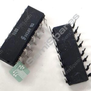 Two black rectangular integrated circuits with metal pins protruding from their sides, laid on a white surface with a small green circuit-board tag nearby.