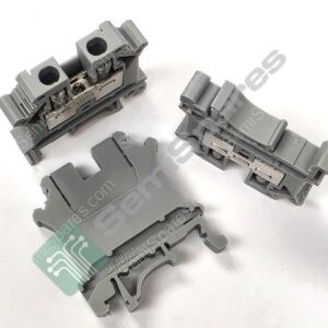 Close-up of gray plastic connector modules with metal contacts on a white background