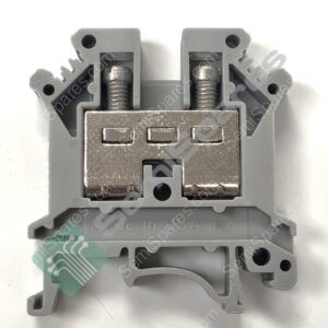 Close-up of a gray electrical terminal block with two screw/clamp terminals and metal contacts; green circuit-pattern sticker partially visible at the edge.