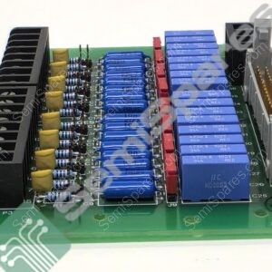 Close-up of a PCB section showing blue rectangular capacitors, yellow tubular capacitors, resistors, and a black heatsink on the left with a gray connector on the right side.