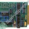 Green printed circuit board with multiple integrated circuit chips and a gold-edge connector, suggesting a vintage computer board.