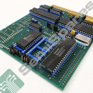 Green circuit board with multiple blue DIP sockets and black integrated circuits, edge connector along top, viewed at an angle.