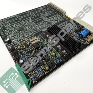 Close-up of a dense printed circuit board populated with ICs, resistors, capacitors, and a large edge connector