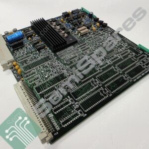 Printed circuit board with a black heatsink, blue capacitors, and multiple ICs, photographed at an angle of view.
