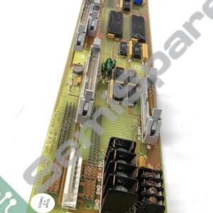 Long PCB with edge connectors, multiple IC chips, capacitors, and a blue connector module on a slanted board image