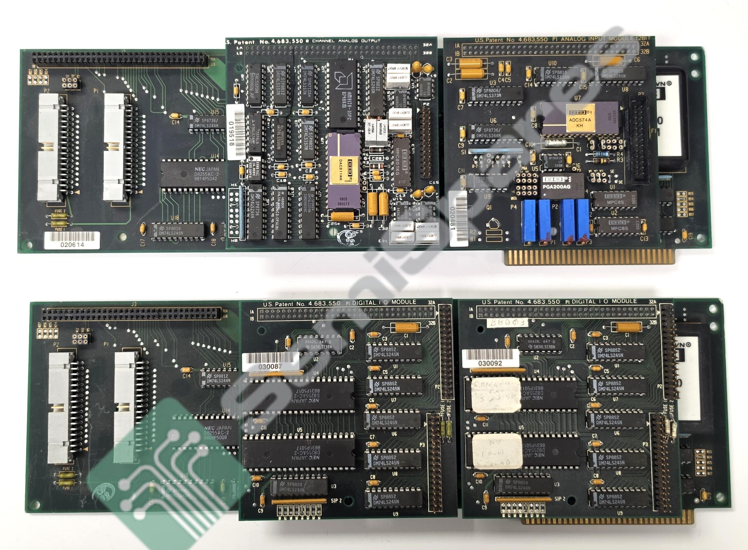Row of vintage computer circuit boards with edge connectors and numerous integrated chips.