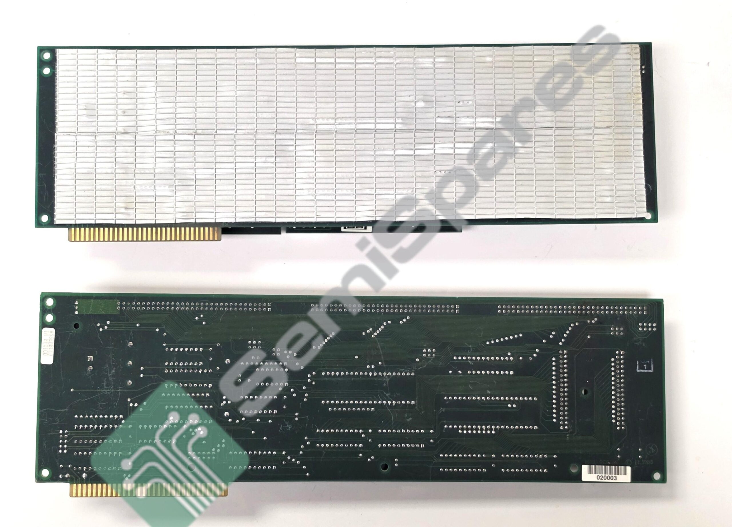 PCI expansion card with gold edge connector and a large metal grid shield on top, green PCB visible on sides